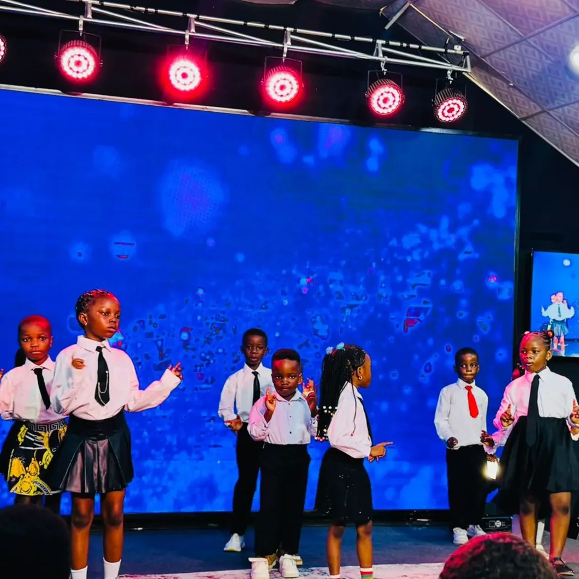 Children participating together on the EDSA stage.